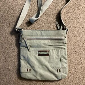 Woman’s aqua adjustable crossover bag